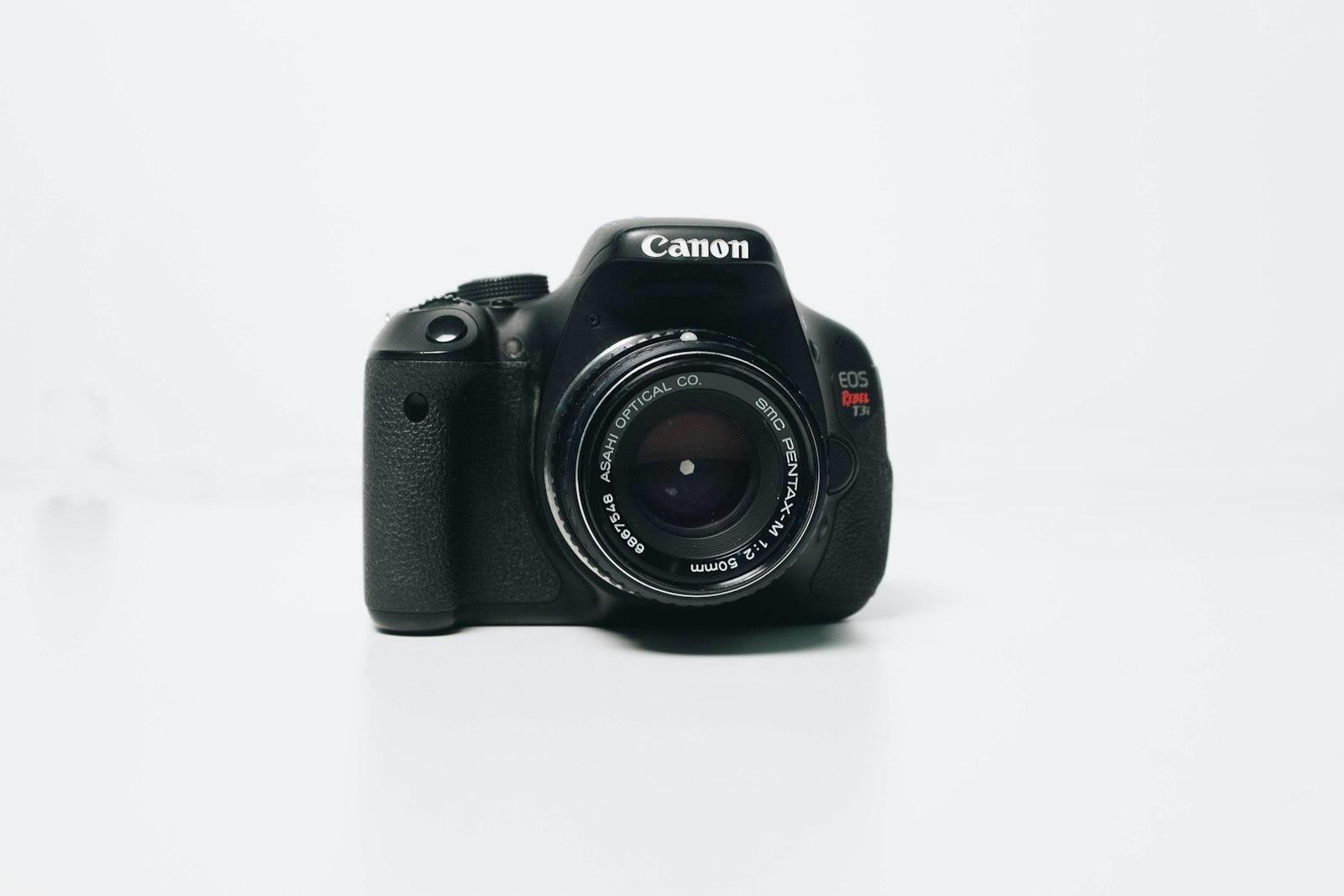 Camera resting on a white surface