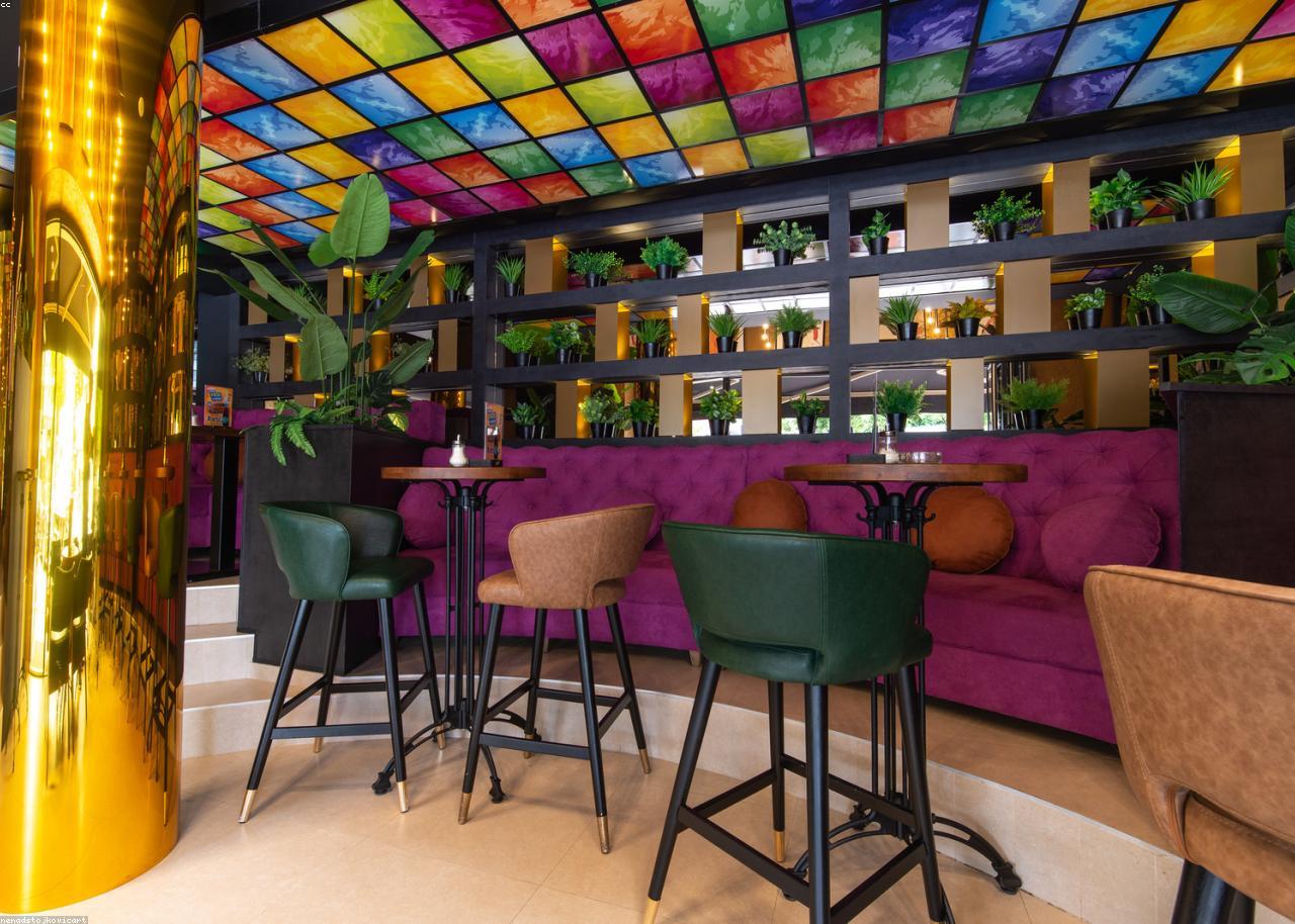 The warm, low-lit lounge at Ember & Rye
