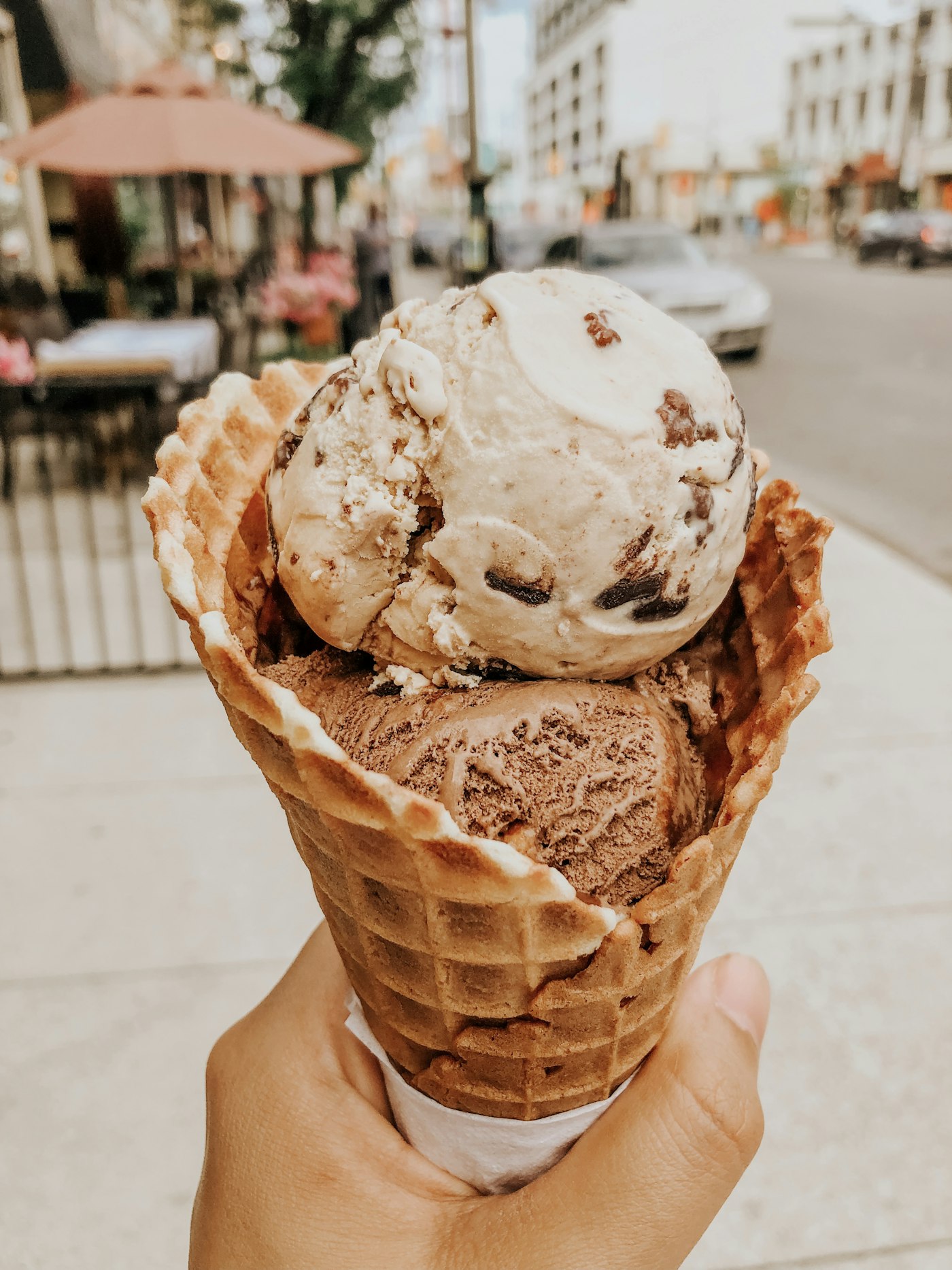 A fresh scoop of Frost Creamery ice cream in a waffle cone