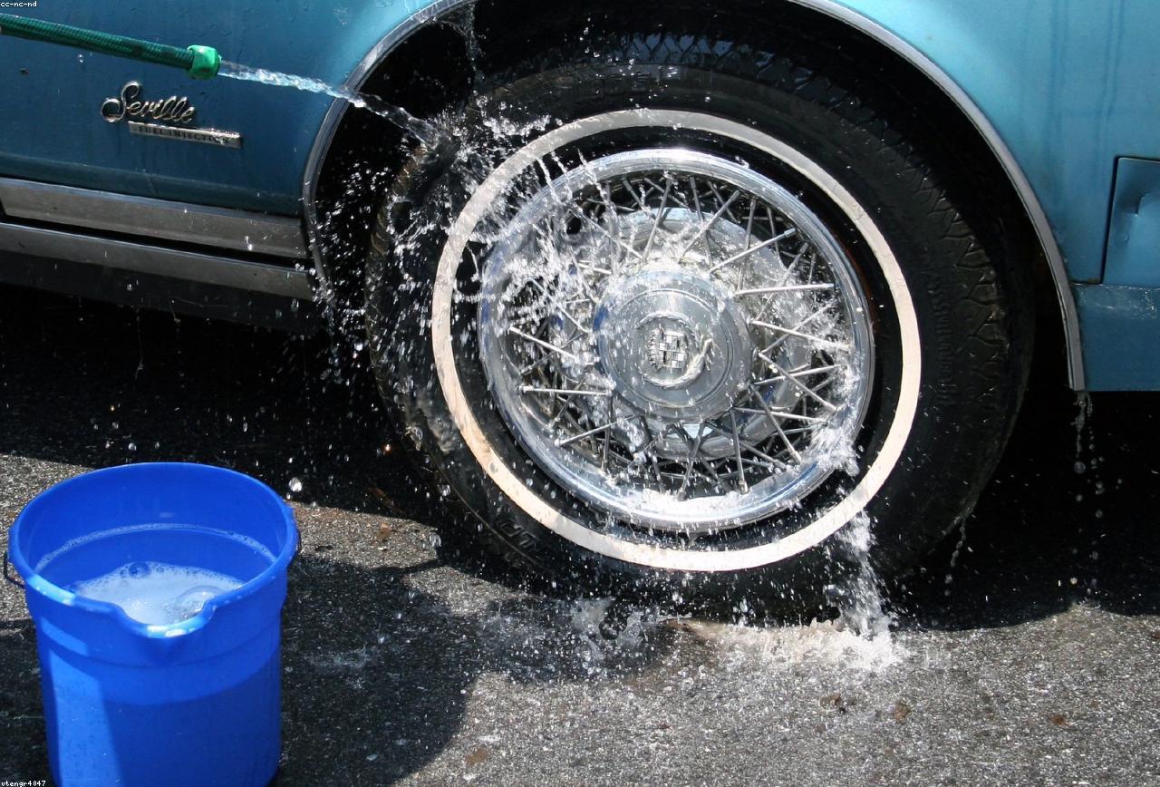 Wheel being carefully hand-washed with foam