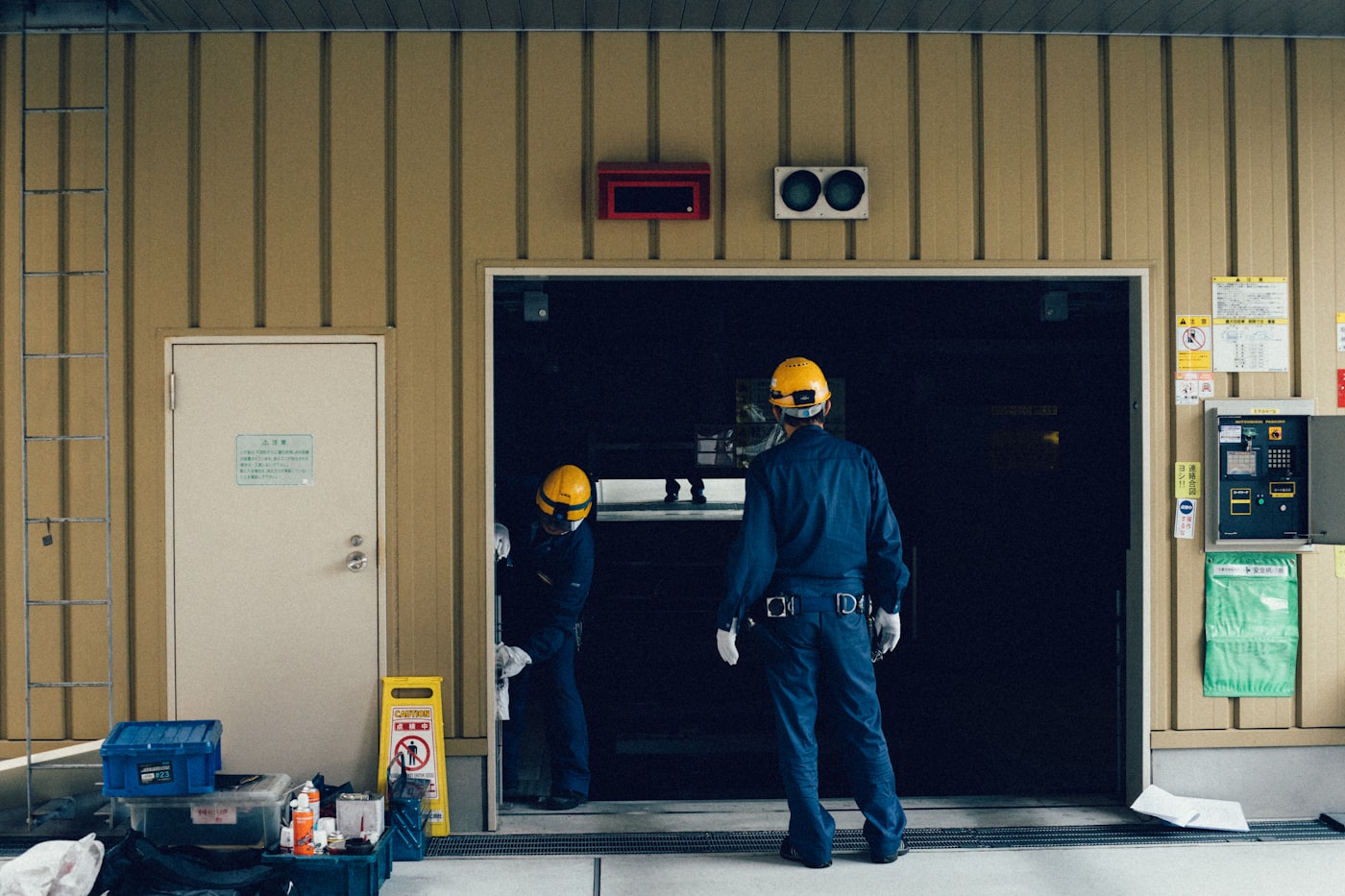 Technicians installing a commercial garage door