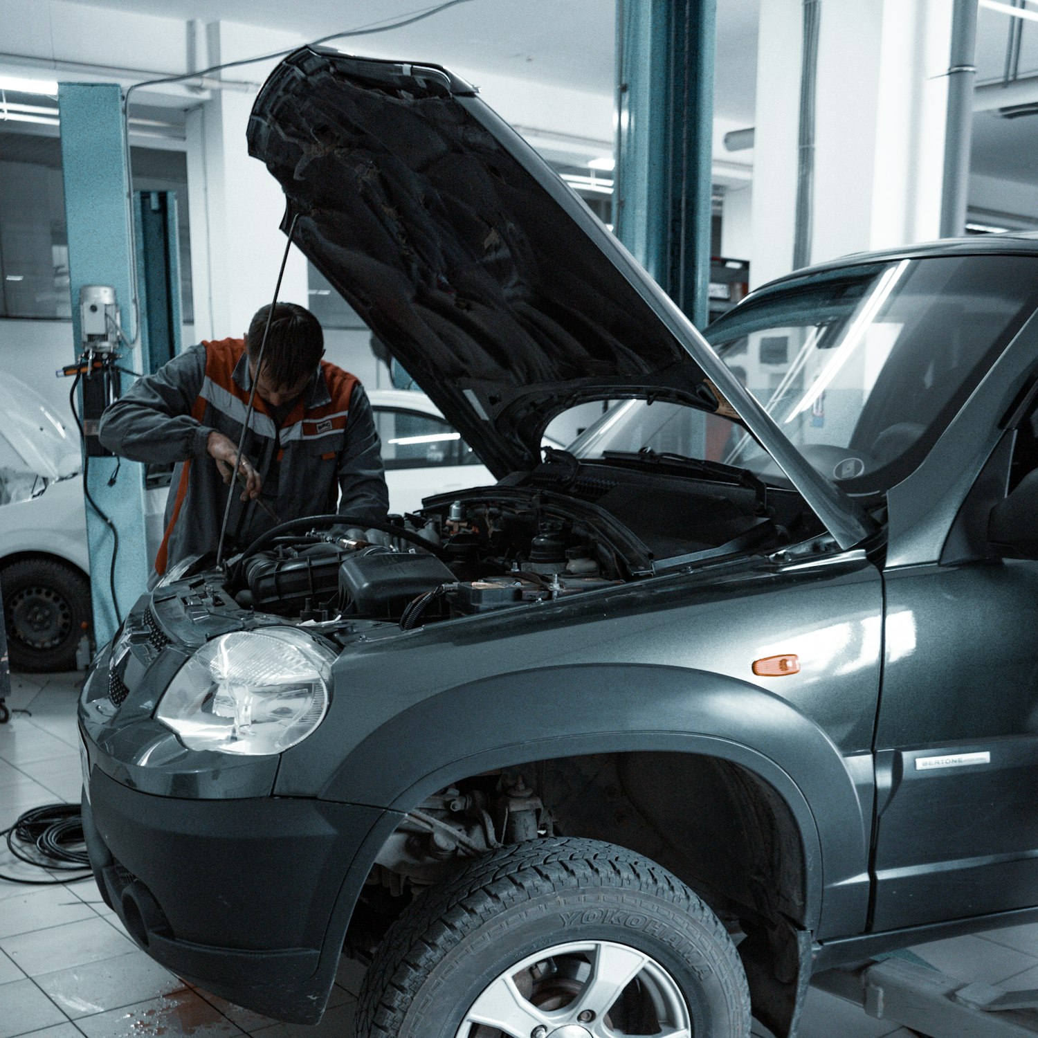 Technician repairing a vehicle